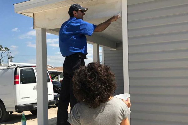 Painting newly built house with Habitat for Humanity | Mel's Diners Community Involvement